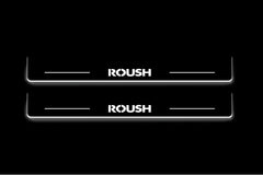 Two long door sill plates with Roush lettering and edges illuminated in white, straight-on view on a dark background.