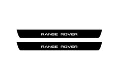 Catalog illustration of two black front door sill plates with Range Rover lettering.