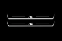 Two long door sill plates with RS lettering and edges illuminated in white, straight-on view on a dark background.