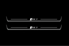 Two long door sill plates with RS7 lettering and edges illuminated in white, straight-on view on a dark background.