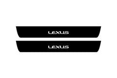 Catalog illustration of two black front door sill plates with Lexus lettering.