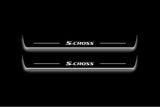 Two long door sill plates with S-Cross lettering and edges illuminated in white, straight-on view on a dark background.