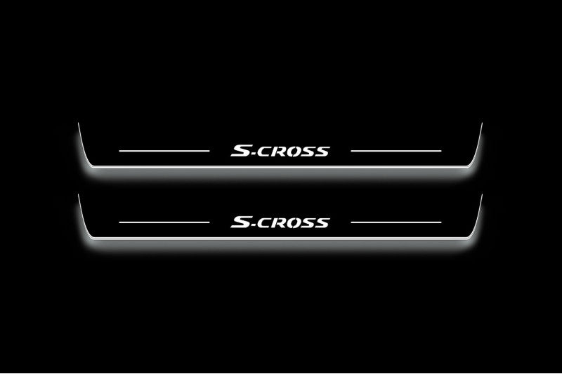 Two long door sill plates with S-Cross lettering and edges illuminated in white, straight-on view on a dark background.