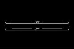 Two long door sill plates with S5 lettering and edges illuminated in white, straight-on view on a dark background.
