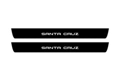 Catalog illustration of two black front door sill plates with Santa Cruz lettering.