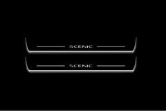 Two long door sill plates with Scenic lettering and edges illuminated in white, straight-on view on a dark background.