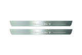 Two long silver-finished door sill plates with Sealion 7 lettering on a light background, straight-on view.