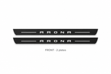 Seat Arona Matte PRO catalogue illustration: two flat black FRONT plates with illuminated ARONA lettering on white background