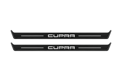 Matte PRO catalogue illustration showing two FRONT plates with illuminated Cupra lettering on a white background; Seat Leon III dimensions are selected during manufacture; rear plates are not pictured.