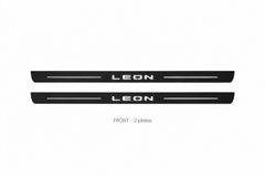 Seat Leon III Matte PRO catalogue illustration: two flat black FRONT plates with illuminated LEON lettering on white background