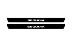 Catalog illustration of two black front door sill plates with Sequoia lettering.