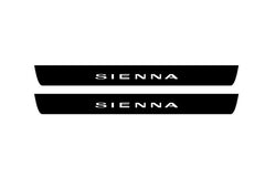 Catalog illustration of two black front door sill plates with Sienna lettering.