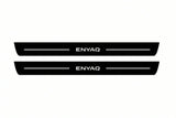 Catalogue illustration of two front black Matte PRO LED door sill plates with illuminated Enyaq lettering for Škoda Enyaq; dimensions are selected during manufacture.