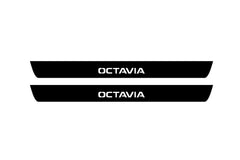 Catalog illustration of two black front door sill plates with Octavia lettering.