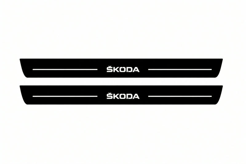 Catalogue illustration of two front black Matte PRO LED door sill plates with illuminated Skoda lettering for Skoda Octavia (A7) III; dimensions are selected during manufacture.