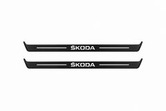 Skoda Octavia (A8) IV Skoda Matte PRO LED door sills, FRONT two-piece catalogue illustration, matte black with white illumination