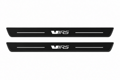 Catalogue demonstration of two black Matte PRO front plates with stylized VRS lettering and straight lines for Škoda Octavia Combi A7; dark side edges are unlit. FRONT+REAR adds two rear plates not pictured; dimensions are selected during manufacture.