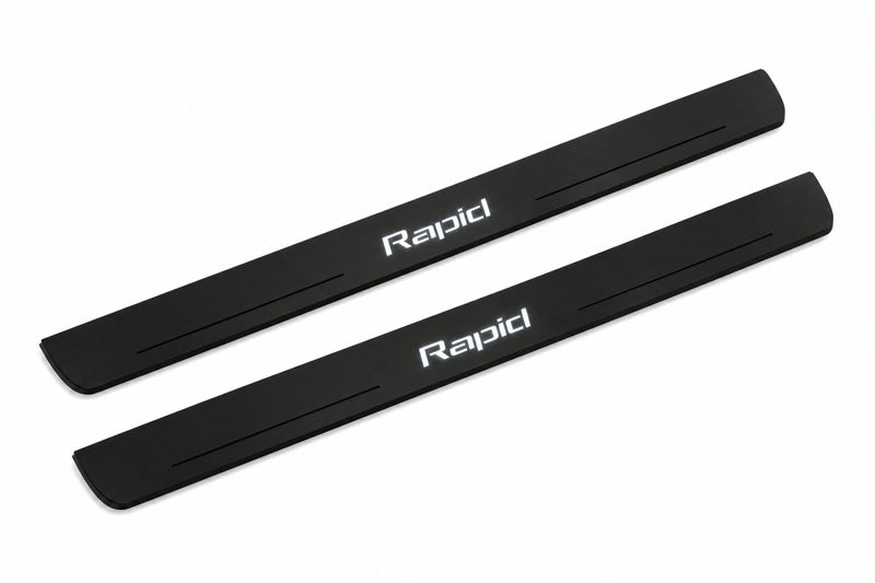 Catalogue illustration of two front black Matte PRO LED door sill plates with illuminated Rapid lettering for Skoda Rapid; dimensions are selected during manufacture.