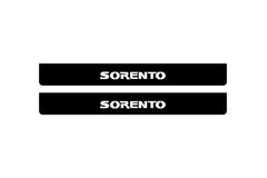 Catalog illustration of two black front door sill plates with Sorento lettering.
