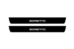 Catalog illustration of two black front door sill plates with Sorento lettering.