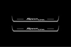 Two long door sill plates with Sport Line lettering and edges illuminated in white, straight-on view on a dark background.