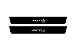 Catalog illustration of two black front door sill plates with centered SRT lettering and Hellcat-head emblems.