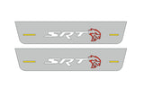 Catalog illustration of two short gray door sill plates with white SRT lettering, red Hellcat-head emblems and yellow horizontal lines on a white background.