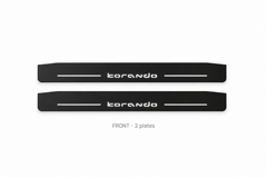 SsangYong Korando Matte PRO catalogue illustration: two flat black FRONT plates with illuminated stylized korando lettering on white