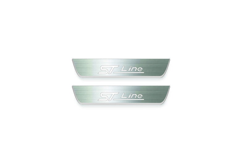 Two short silver-finished door sill plates with ST Line lettering on a light background, straight-on view.