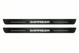 Catalogue illustration of two front black Matte PRO LED door sill plates with illuminated Impreza lettering for Subaru Impreza V; dimensions are selected during manufacture.