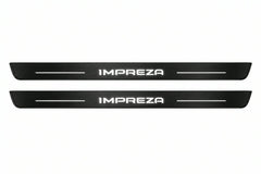 Catalogue illustration of two front black Matte PRO LED door sill plates with illuminated Impreza lettering for Subaru Impreza V; dimensions are selected during manufacture.