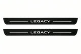 Catalogue illustration of two front black Matte PRO LED door sill plates with illuminated Legacy lettering for Subaru Legacy V; dimensions are selected during manufacture.