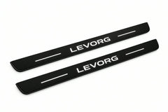 Catalogue illustration of two front black Matte PRO LED door sill plates with illuminated Levorg lettering for Subaru Levorg I; dimensions are selected during manufacture.