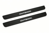 Catalogue illustration of two front black Matte PRO LED door sill plates with illuminated Outback lettering for Subaru Outback IV; dimensions are selected during manufacture.