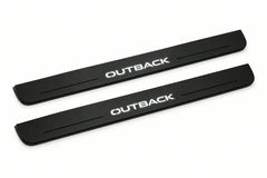 Catalogue illustration of two front black Matte PRO LED door sill plates with illuminated Outback lettering for Subaru Outback IV; dimensions are selected during manufacture.