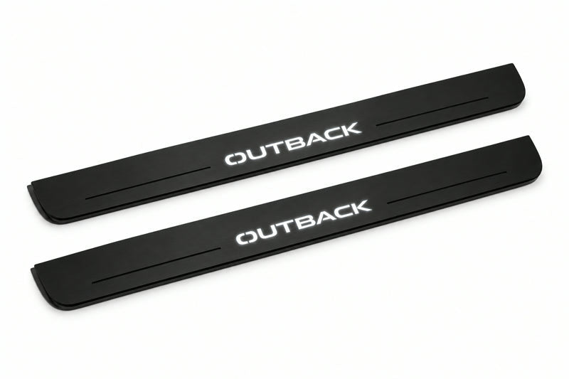 Catalogue illustration of two front black Matte PRO LED door sill plates with illuminated Outback lettering for Subaru Outback IV; dimensions are selected during manufacture.