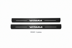 Suzuki Vitara Matte PRO catalogue illustration: two flat black FRONT plates with illuminated VITARA lettering on white background