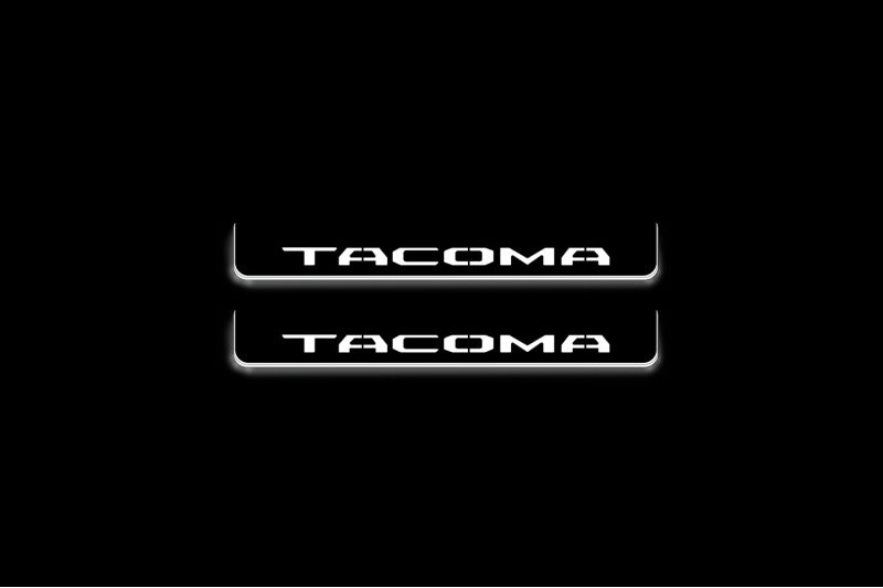 LED door sill plates Toyota Tacoma IV 2024+ in stainless steel with Tacoma logo