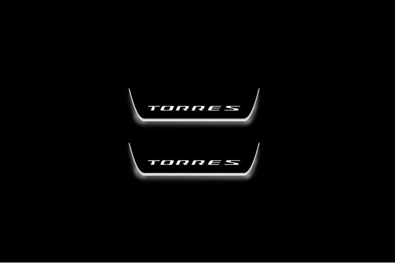 Two short door sill plates with Torres lettering and edges illuminated in white, straight-on view on a dark background.