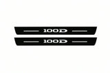 Catalogue illustration of two front black Matte PRO LED door sill plates with illuminated 100D lettering for Tesla Model S; dimensions are selected during manufacture.