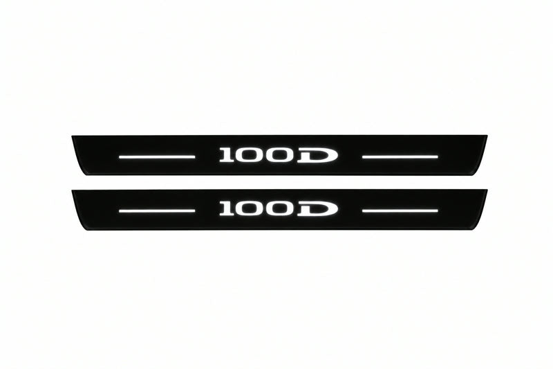 Catalogue illustration of two front black Matte PRO LED door sill plates with illuminated 100D lettering for Tesla Model S; dimensions are selected during manufacture.