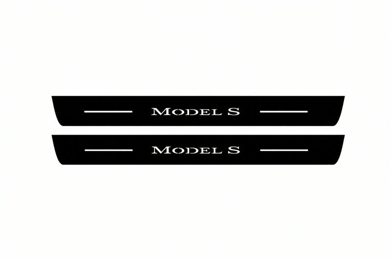 Catalogue illustration of two front black Matte PRO LED door sill plates with illuminated Model S lettering for Tesla Model S; dimensions are selected during manufacture.