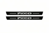Catalogue illustration of two front black Matte PRO LED door sill plates with illuminated P100D lettering for Tesla Model S; dimensions are selected during manufacture.