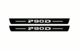 Catalogue illustration of two front black Matte PRO LED door sill plates with illuminated P90D lettering for Tesla Model S; dimensions are selected during manufacture.