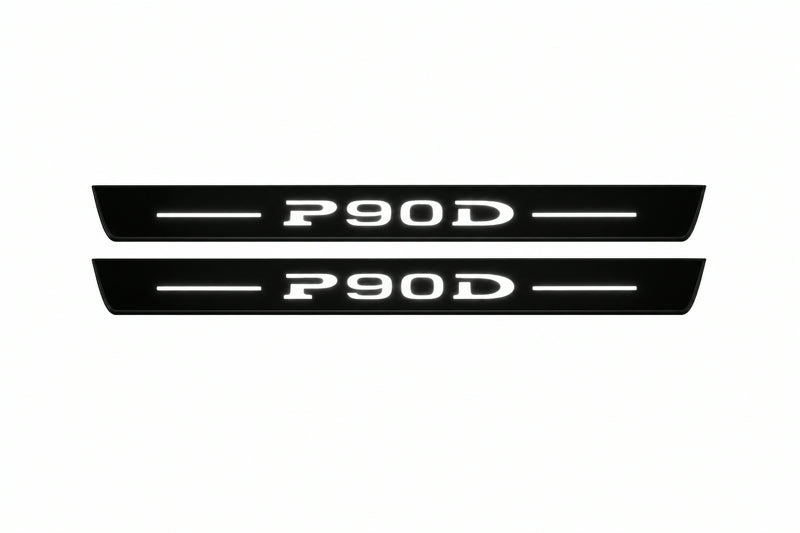 Catalogue illustration of two front black Matte PRO LED door sill plates with illuminated P90D lettering for Tesla Model S; dimensions are selected during manufacture.