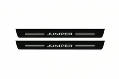 Catalogue illustration of two front black Matte PRO LED door sill plates with illuminated Juniper lettering for Tesla Model Y Juniper; dimensions are selected during manufacture.