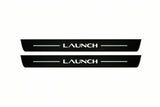 Catalogue illustration of two front black Matte PRO LED door sill plates with illuminated Launch lettering for Tesla Model Y Juniper; dimensions are selected during manufacture.