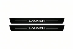 Catalogue illustration of two front black Matte PRO LED door sill plates with illuminated Launch lettering for Tesla Model Y Juniper; dimensions are selected during manufacture.