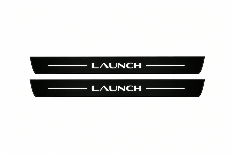 Catalogue illustration of two front black Matte PRO LED door sill plates with illuminated Launch lettering for Tesla Model Y Juniper; dimensions are selected during manufacture.
