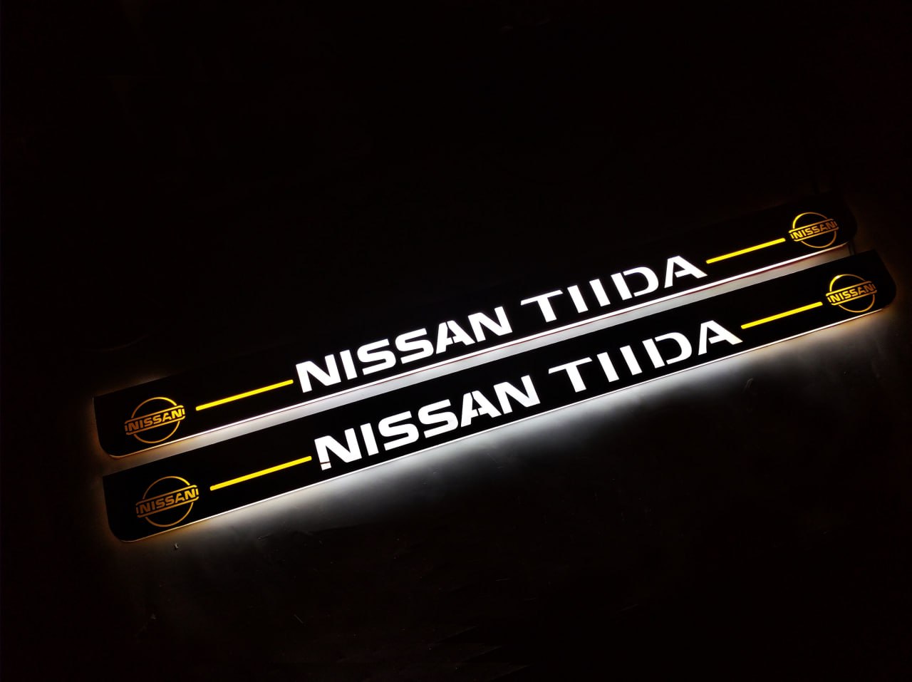 LED door sill plates Nissan Tiida 2004+ in stainless steel with TIIDA logo